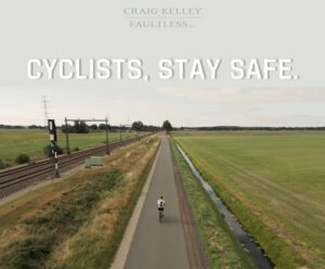 A cyclist in the middle of the road