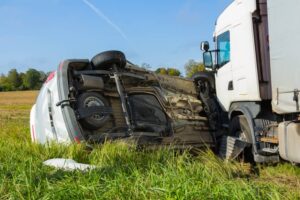 Car overturned after colliding with truck