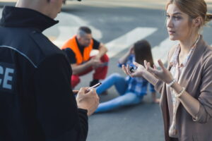 Driver talking to traffic police after accident